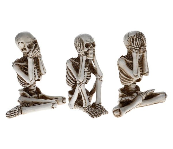 Skeletons in a speak-, hear-, and see-no-evil positions